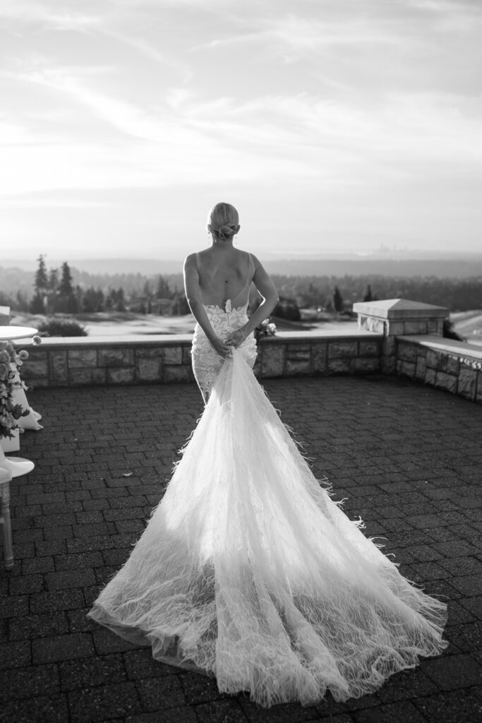 black and white photo of bride walking away